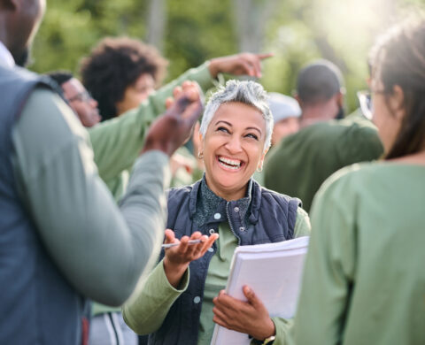 Volunteer, Team And People In Nature For Community Service, Teamwork And Planning With Leadership, Goals And Strategy. Senior Person Or Leader For Management In Forest, Park Or Eco Friendly Project